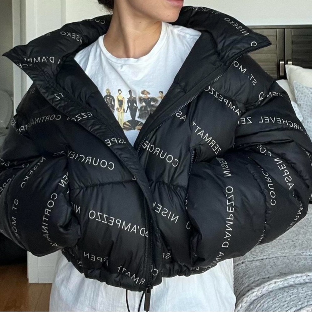 Black Puffer Jacket with White Lettering